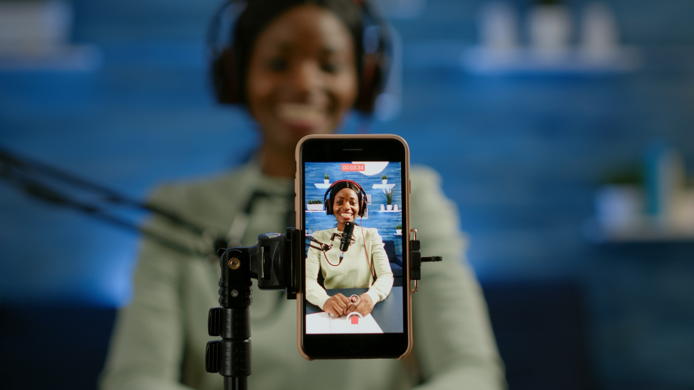 Young entrepreneur managing smartphone retail sales